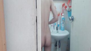 Step cougar putting on a shower inside the restroom live on webcam