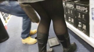 Adorable Beauty into african tights, mini skirt and boots