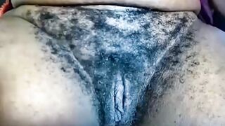 Old huge bushy ebony twat, close-up