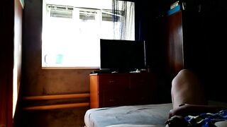 Milf fucks herself for window cleaner