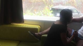 Fiance giving risky fellatio into front of window into a camping