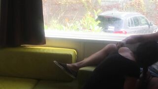 Fiance giving risky fellatio into front of window into a camping
