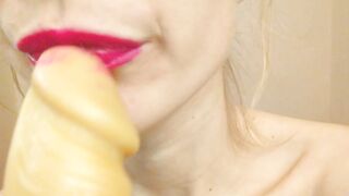 Blowing penis inside pink lipstick
