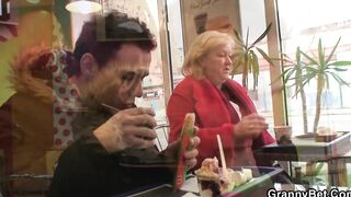 Young guy picks up long mature grandmother for play