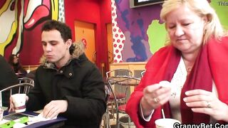 Young guy picks up long mature grandmother for play