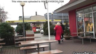 Young guy picks up long mature grandmother for play