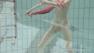 Katya Okuneva gets naked into her red panties underwater