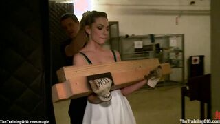 Blonde carries heavy wooden billets