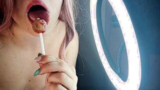 A LITTLE BITCH BLOWS A LOLLIPOP AND SHOWS HER TITTED
