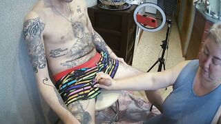I'm sitting on a stool, a fat woman jerks off my penis