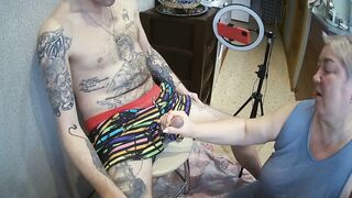 I'm sitting on a stool, a fat woman jerks off my penis