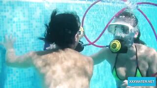 Underwater lesbians lick and suck vibrators