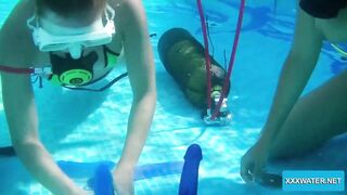Underwater lesbians lick and suck vibrators