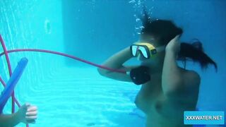 Underwater lesbians lick and suck vibrators