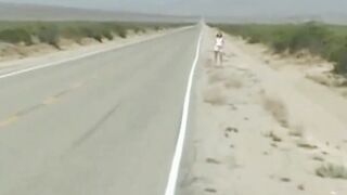 She stands into the dessert and stop a bus -