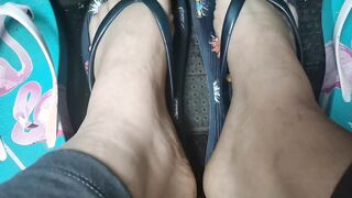 Nicoletta's cute little toes into flip-flops press on the pedals