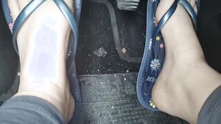 Nicoletta's cute little toes into flip-flops press on the pedals
