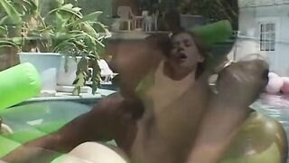 Interracial lesbians having fun inside pool
