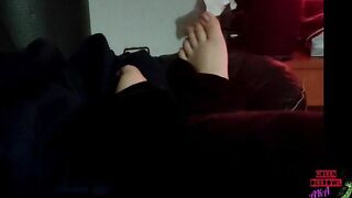 Moving toes on the leather sofa