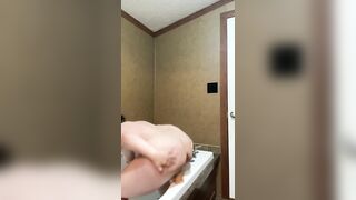 cougar jizzes rough rides sex toy inside the bath-tub