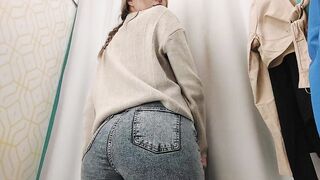 Young bimbos inside the fitting room of the store