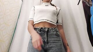 Young bimbos inside the fitting room of the store