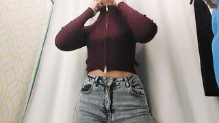 Young bimbos inside the fitting room of the store