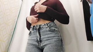 Young bimbos inside the fitting room of the store