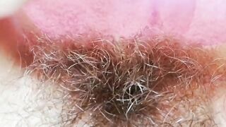 Extremely bushy snatch with huge lips close-up