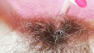 Extremely bushy snatch with huge lips close-up