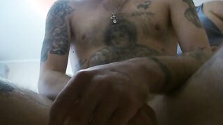 a woman jerks off my cock into a chair close up
