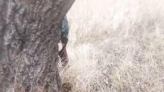 She pissed under a tree. Piss pouring out of twat
