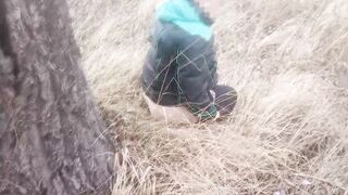 She pissed under a tree. Piss pouring out of twat