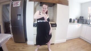 Pregnant showing off baby belly inside minidress