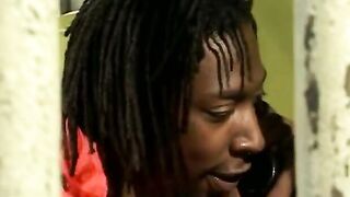 African women is on her knees blowing on a penis like a whore