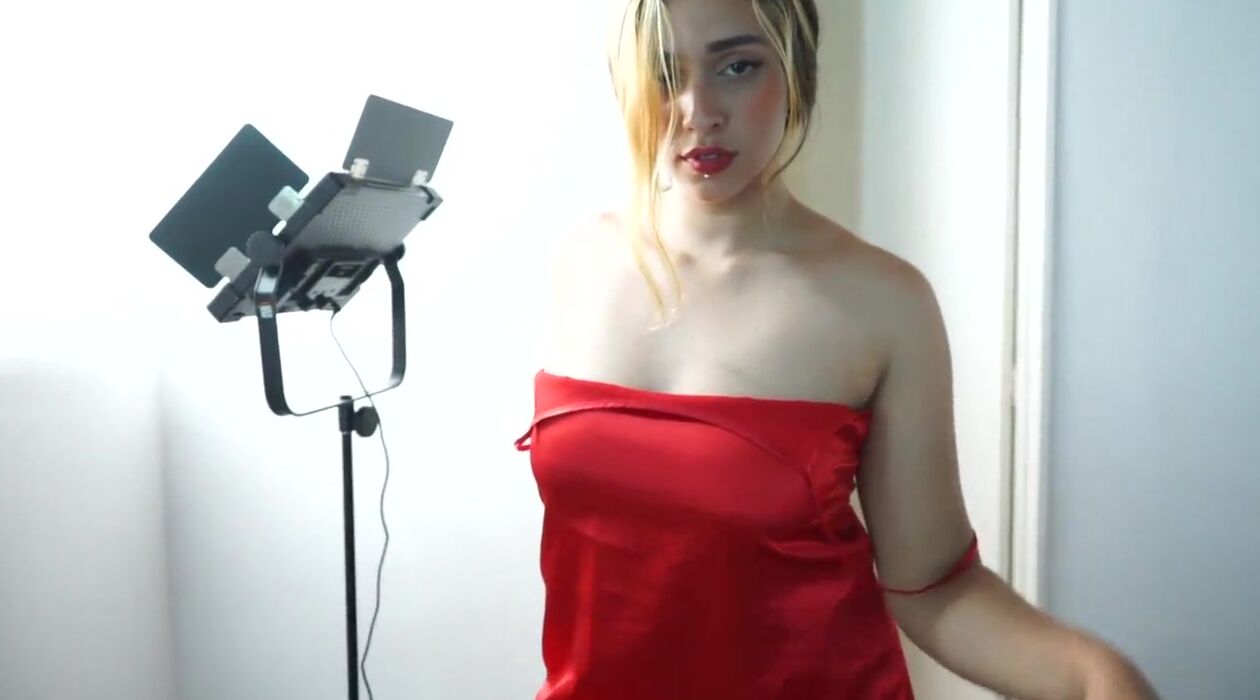 Love4Porn Presents The Beauty chick into the red dress pic