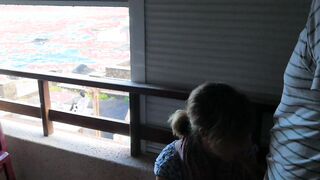 Balcony fellatio really near the people