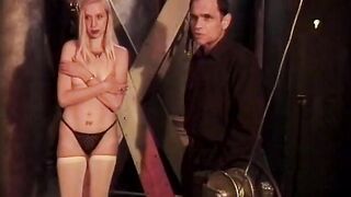 Beauty blonde is tied inside red and has clamps applied by sadist