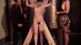 Beauty blonde is tied inside red and has clamps applied by sadist