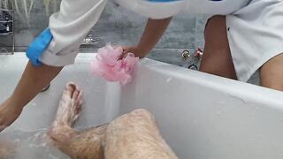 A nurse jerks off a man's penis inside the restroom