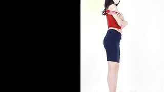 A older woman takes off her bright red Cutie underwear
