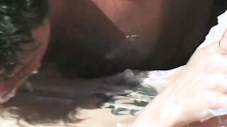 Lovers got covered with whipped cream and lick each other