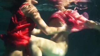 Lesbians and solo girls make out underwater