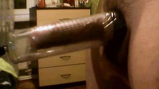 Long penis pumped up inside a vacuum pump