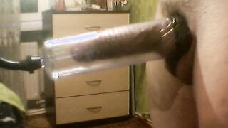 Long penis pumped up inside a vacuum pump