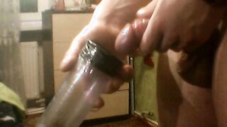 Long penis pumped up inside a vacuum pump