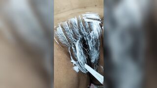 Cindy shaving her bushy twat.