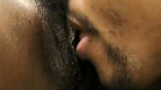 Shaved bastard is licking her ebony vagina