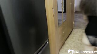 A head and a cowgirl inside the kitchen