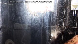 Young man eating his friend's aunt inside the restroom of